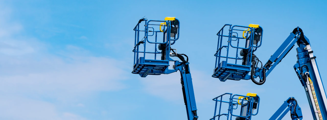 blue aerial and scissor lifts